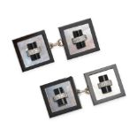A PAIR OF ONYX, DIAMOND, AND MOTHER OF PEARL CUFFLINKS in white gold, each square cufflink with a...