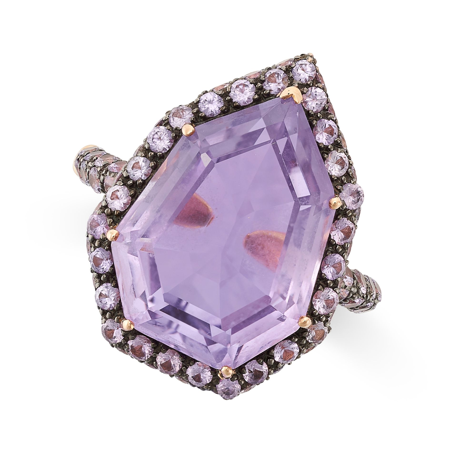 AN AMETHYST DRESS RING in 18ct rose gold, set with a fancy cut amethyst in a border of round cut ...