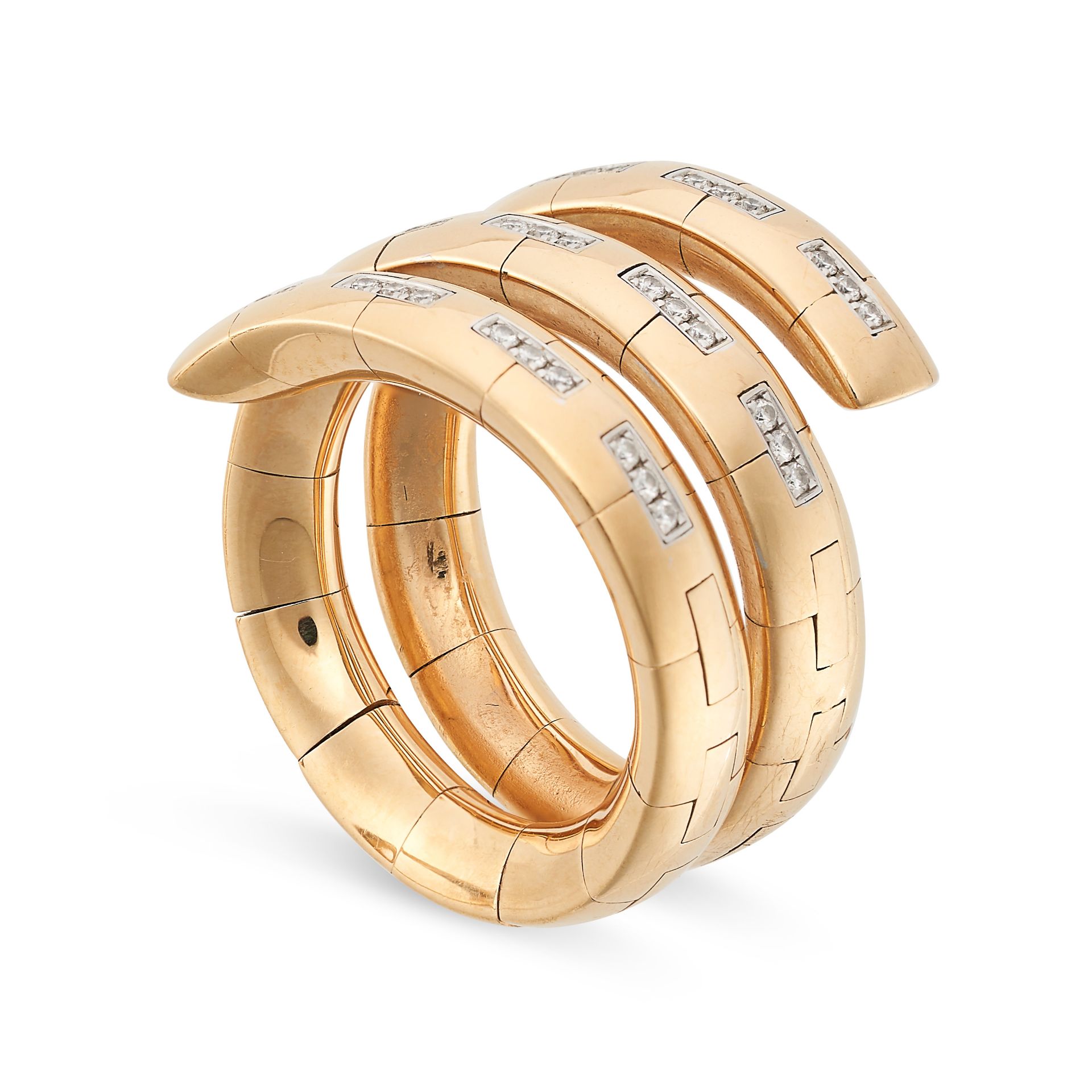 A DIAMOND SPIRAL RING in 18ct yellow gold, in a flexible link spiral design set with sections of ...