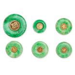 A GROUP OF CHINESE JADEITE JADE DISCS comprising six polished jadeite jade discs each set to the ...