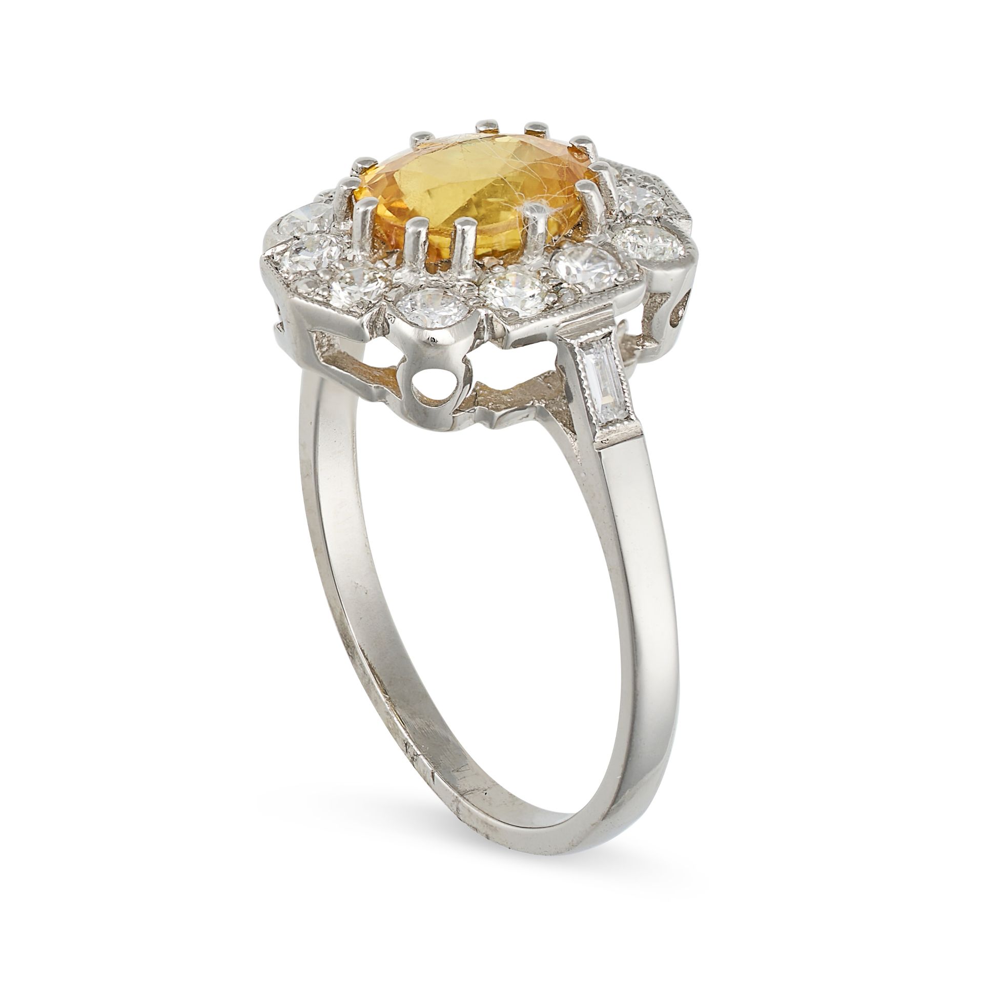 A YELLOW SAPPHIRE AND DIAMOND CLUSTER RING in platinum, set with an oval cut yellow sapphire of a... - Image 2 of 2