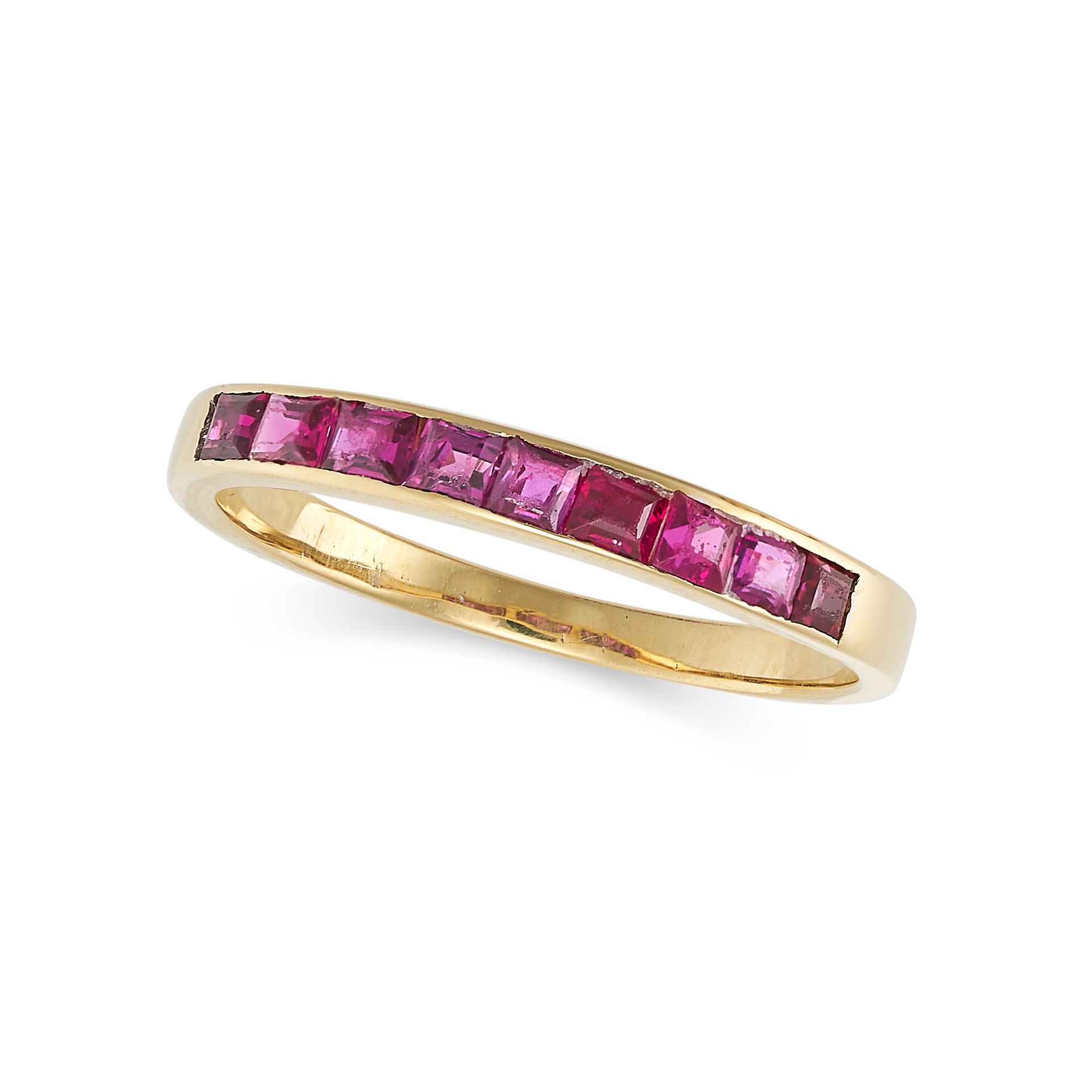 A RUBY HALF ETERNITY RING in 18ct yellow gold, the band half set with a row of step cut rubies, s...