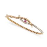 A PEARL AND RUBY BANGLE in tri-coloured gold, set with a round cut ruby between two pearls, over ...