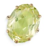 A SYNTHETIC GREEN SPINEL DRESS RING in 9ct yellow gold, set with an oval cut synthetic green spin...