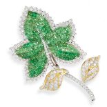 A TSAVORITE GARNET AND DIAMOND BROOCH in the form of an ivy leaf, invisibly set with calibre cut ...
