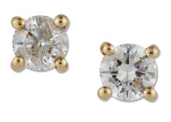 A PAIR OF SOLITAIRE DIAMOND EARRINGS