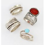 THREE MEXICAN SILVER RINGS AND AN ISRAELI SILVER CARNELIAN RING