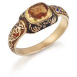 A HESSONITE GARNET AND ENAMEL RING