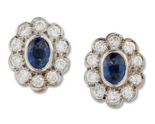 A PAIR OF 18 CARAT WHITE GOLD SAPPHIRE AND DIAMOND CLUSTER EARRINGS