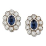 A PAIR OF 18 CARAT WHITE GOLD SAPPHIRE AND DIAMOND CLUSTER EARRINGS