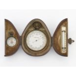 A CASED BAROMETER, THERMOMETER AND COMPASS TRAVELLING SET