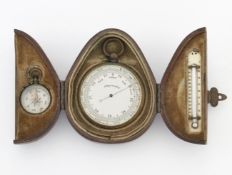 A CASED BAROMETER, THERMOMETER AND COMPASS TRAVELLING SET
