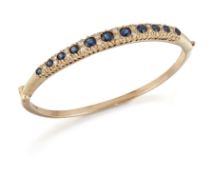 A SAPPHIRE AND DIAMOND BANGLE