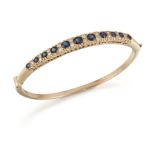 A SAPPHIRE AND DIAMOND BANGLE