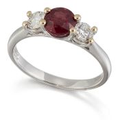 AN 18 CARAT WHITE GOLD RUBY AND DIAMOND THREE STONE RING