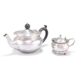 AN EDWARDIAN SILVER TEAPOT AND A GEORGE V SILVER MUSTARD