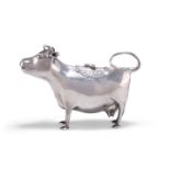 A GEORGE III SILVER COW CREAMER