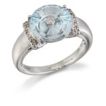 GLENN LEHRER - A 9 CARAT WHITE GOLD BLUE TOPAZ AND DIAMOND 'TORUSRING' RING