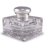 A GEORGE V SILVER-TOPPED CUT-GLASS INKWELL