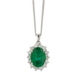 AN 18 CARAT WHITE GOLD EMERALD AND DIAMOND CLUSTER PENDANT ON CHAIN