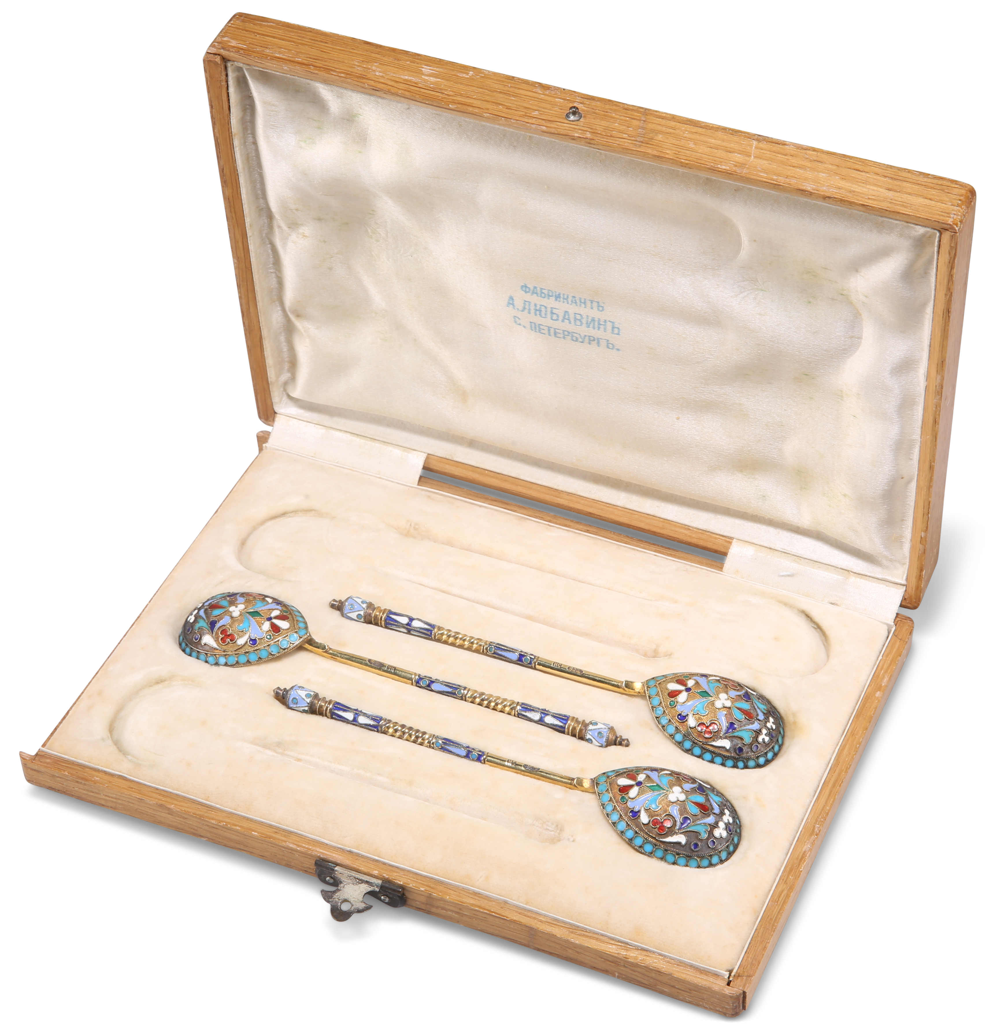 A SET OF THREE RUSSIAN SILVER AND ENAMEL SPOONS