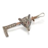 A NOVELTY DIAMOND AND RUBY FOX AND CROP BROOCH