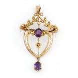 AN ART NOUVEAU AMETHYST AND SEED PEARL BROOCH / PENDANT