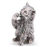 A SILVER MODEL OF A CAT