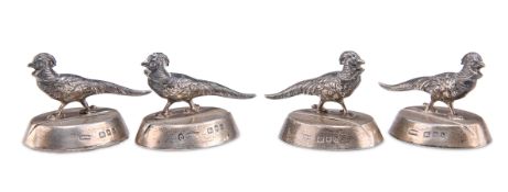 A SET OF FOUR GEORGE V SILVER PLACE CARD HOLDERS