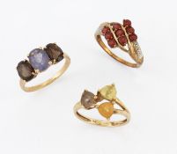 THREE 9 CARAT GOLD GEM-SET RINGS