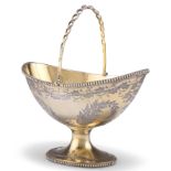 A VICTORIAN SILVER-GILT SUGAR BASKET