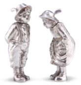 A PAIR OF CONTINENTAL CAST SILVER NOVELTY PEPPERS