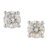 A PAIR OF SOLITAIRE DIAMOND EARRINGS