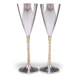 STUART DEVLIN: A PAIR OF ELIZABETH II PARCEL-GILT SILVER GOBLETS