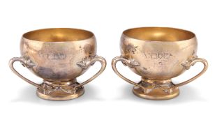 A PAIR OF GEORGE V SILVER-GILT SMALL TYGS