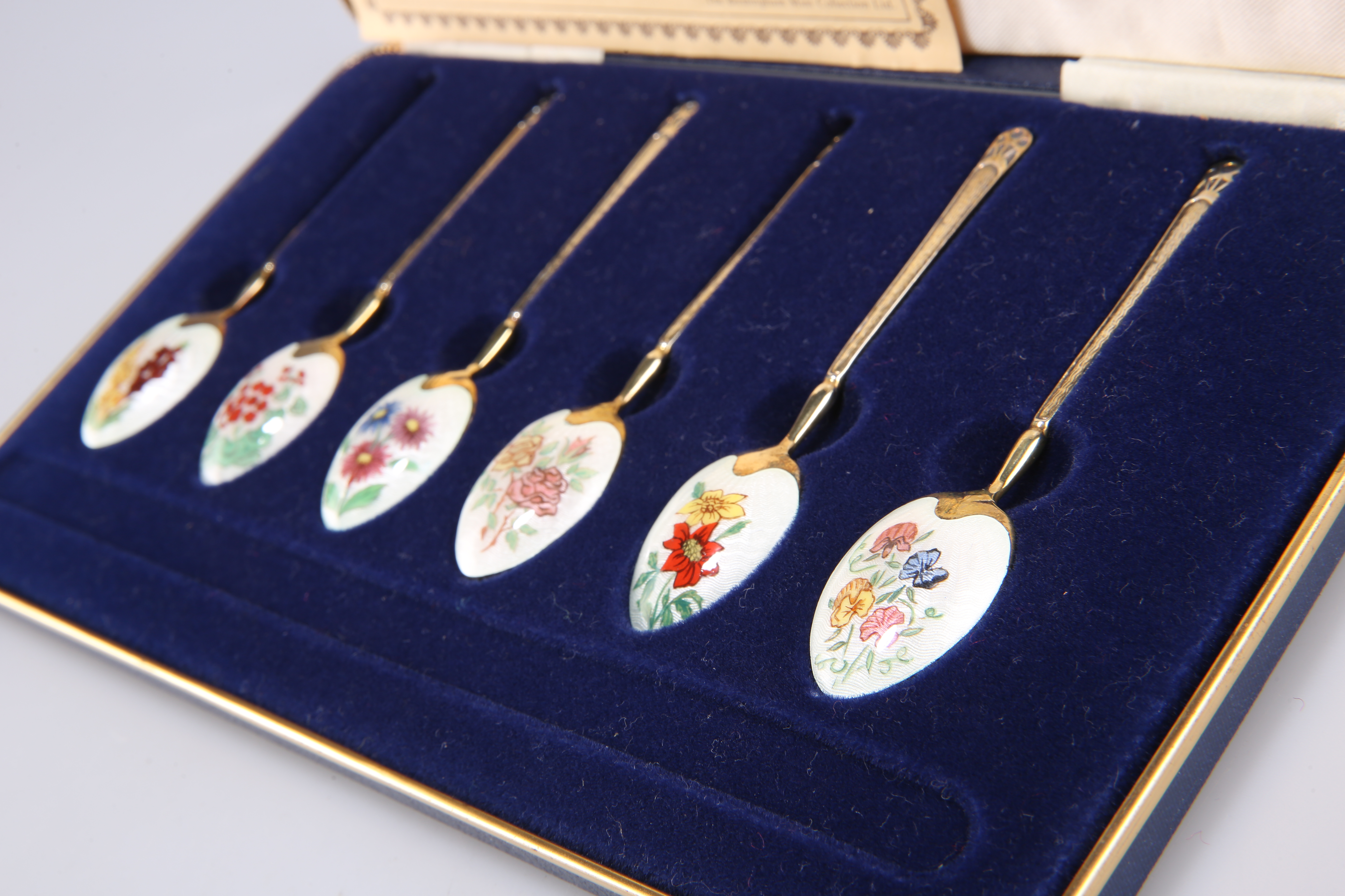 A SET OF SIX ELIZABETH II SILVER-GILT AND ENAMEL LIMITED EDITION SPOONS - Image 2 of 2