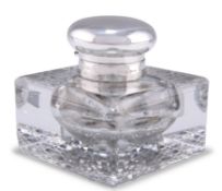 AN EDWARDIAN SILVER-TOPPED CUT-GLASS INKWELL