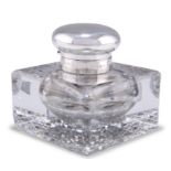 AN EDWARDIAN SILVER-TOPPED CUT-GLASS INKWELL