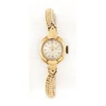 A LADY'S 18 CARAT GOLD OMEGA BRACELET WATCH