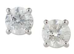 A PAIR OF SOLITAIRE DIAMOND EARRINGS