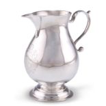 A GEORGE II SILVER CREAM JUG