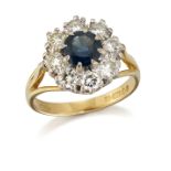 AN 18 CARAT GOLD SAPPHIRE AND DIAMOND CLUSTER RING
