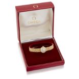 A LADY'S 18 CARAT GOLD OMEGA BRACELET WATCH