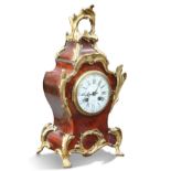 A LATE 19TH CENTURY FRENCH RED TORTOISESHELL AND ORMOLU MANTEL CLOCK