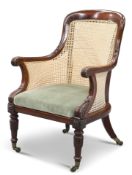 A REGENCY MAHOGANY AND CANEWORK BERGÈRE