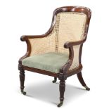 A REGENCY MAHOGANY AND CANEWORK BERGÈRE