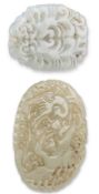 TWO CHINESE CARVED AND PIERCED JADE PENDANT PLAQUES