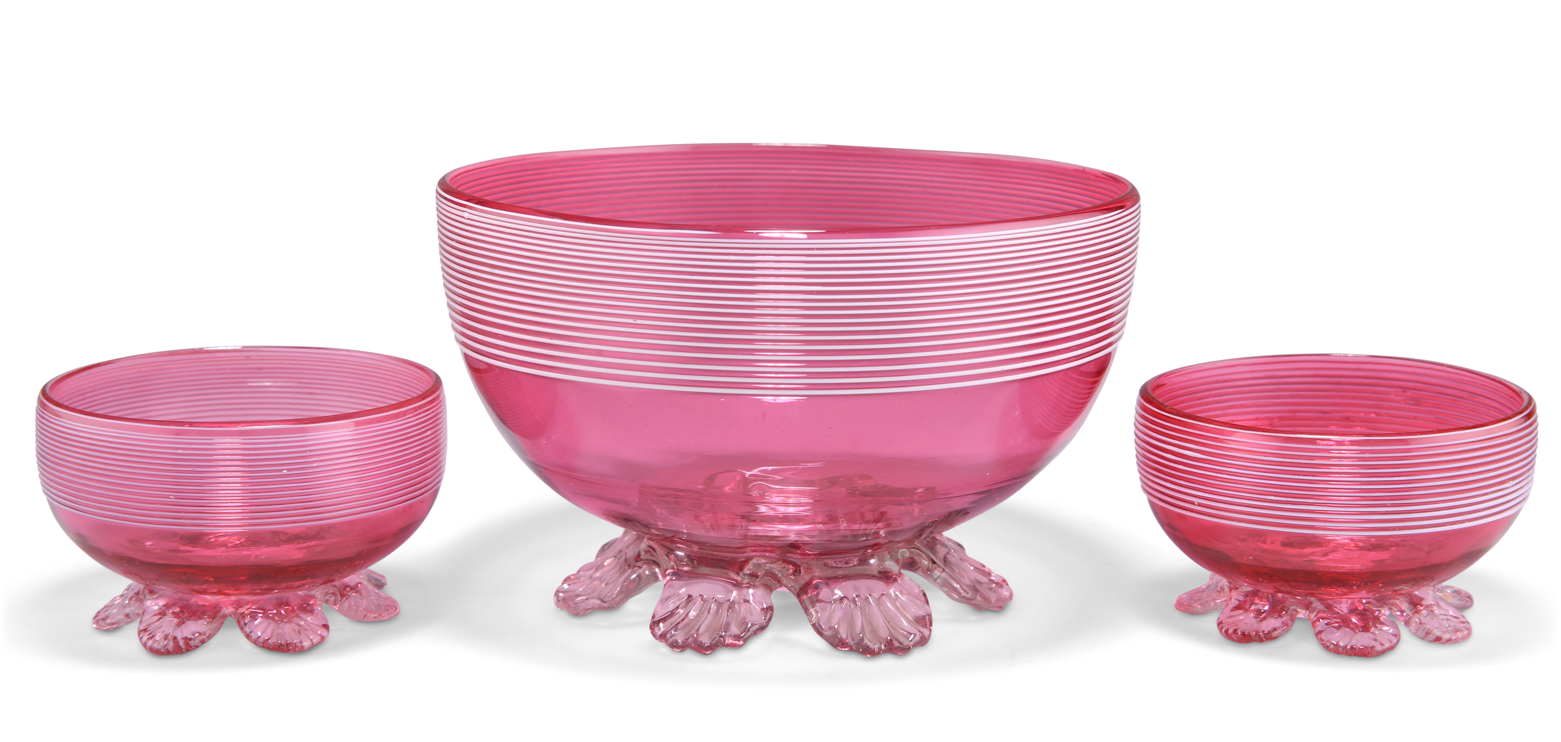 A LARGE CRANBERRY GLASS BOWL AND A SMALL PAIR OF BOWLS