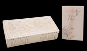A CHINESE CARVED IVORY BOX AND COVER AND A JAPANESE IVORY CARD CASE