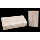 A CHINESE CARVED IVORY BOX AND COVER AND A JAPANESE IVORY CARD CASE